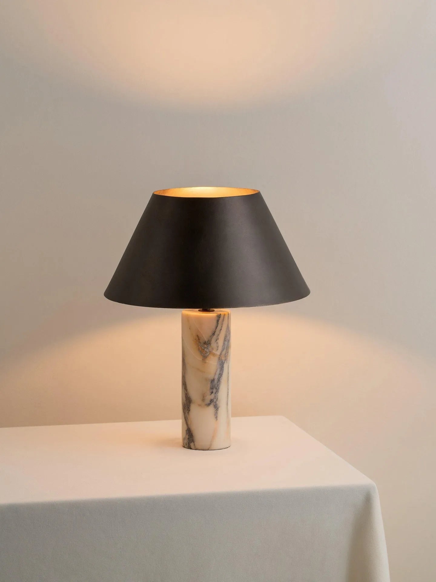 Black marble table lamp with modern design on wooden surface