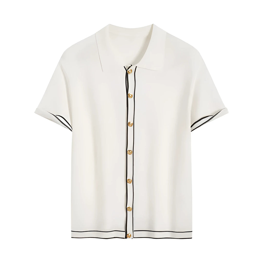 White short sleeve women's cardigan with dark contrasting lapels laid flat.