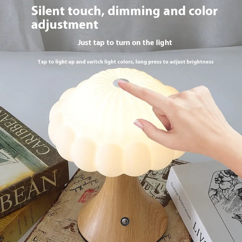 Mushroom-shaped USB rechargeable touch lamp in wood grain finish on table