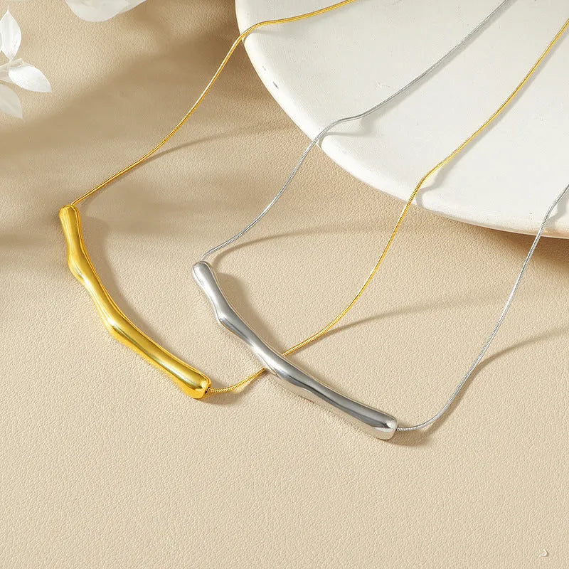 Women's titanium steel necklace with irregular pleated pendant in gold or steel electroplated finishes