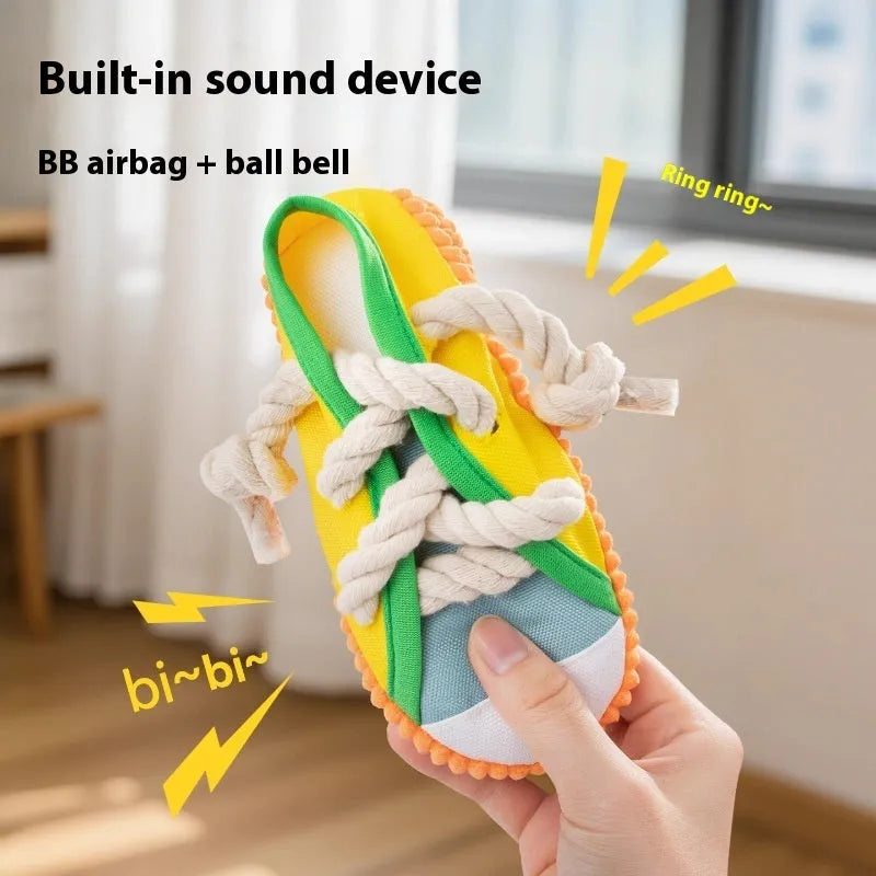 Plastic dog chew toy in three colours with bendable design and sound mechanism