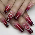 Wine red gradient fake nail tips with pearl heart design and plaid pattern in long ballet style