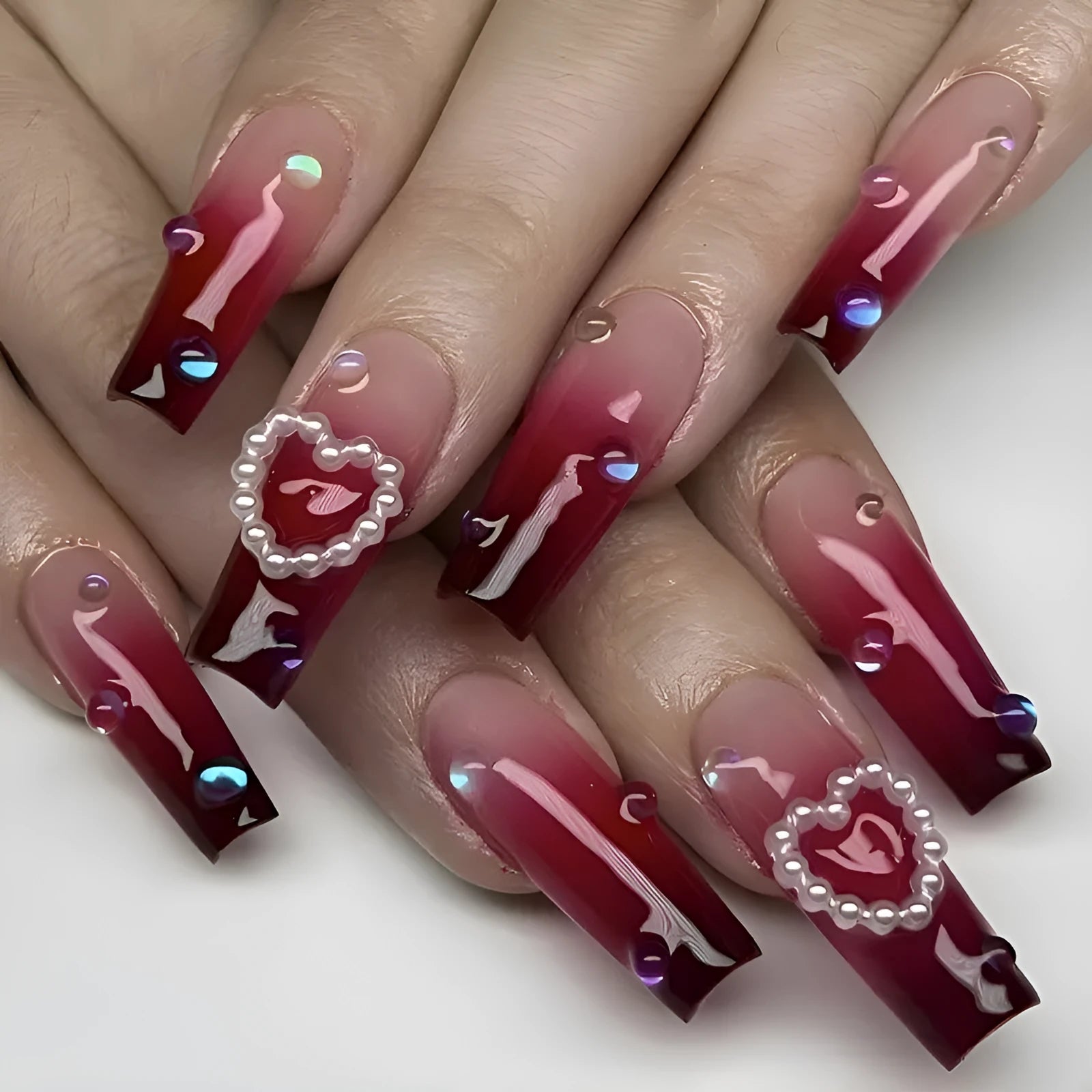 Wine red gradient fake nail tips with pearl heart design and plaid pattern in long ballet style