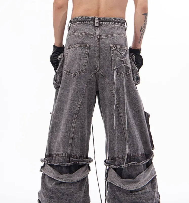 Grey denim distressed overalls with rope stitching and a wide-leg mop pants silhouette.
