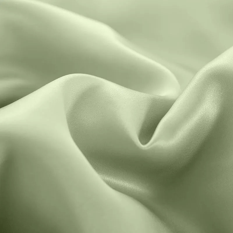 Double-sided silk duvet cover in six solid colours showing smooth plain weave texture