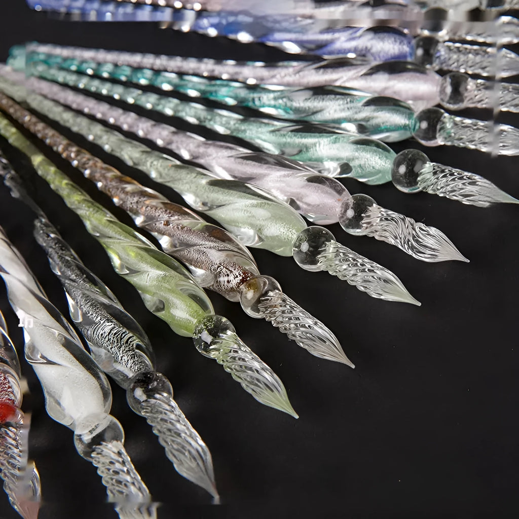 Transparent coloured glaze crystal pen in a gift box, showing abstract glass design.