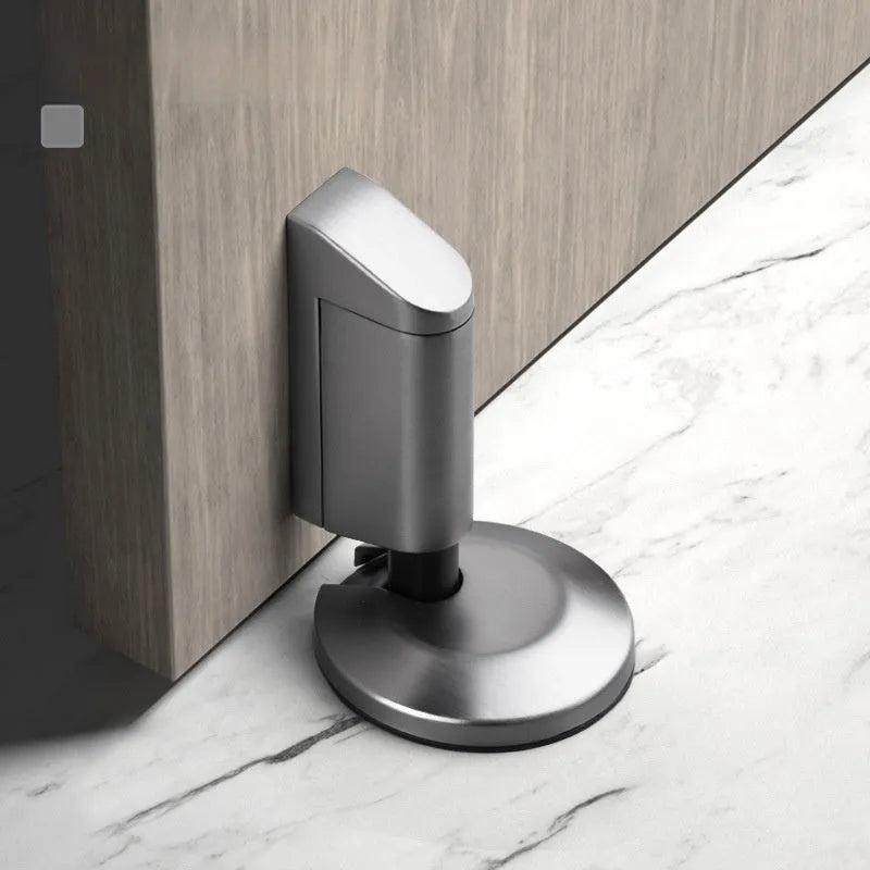 Modern zinc alloy door stopper in brushed nickel finish mounted on floor