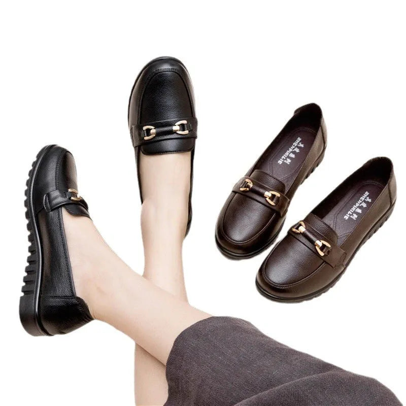 Black women's soft leather casual pumps with a low flat heel and round toe.