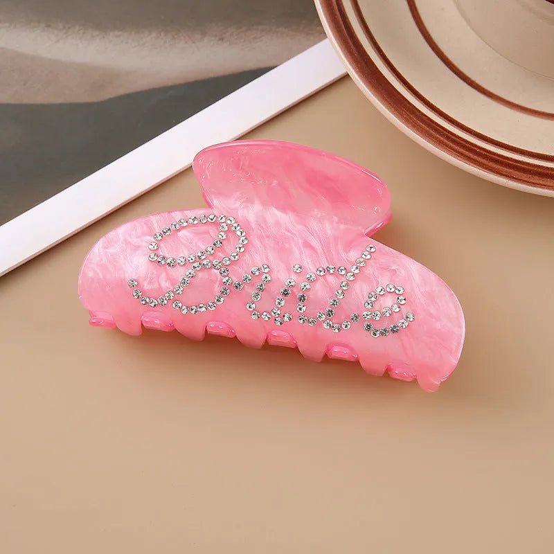 Pink and white acrylic hair clip with spot drill pattern and double-sided decoration