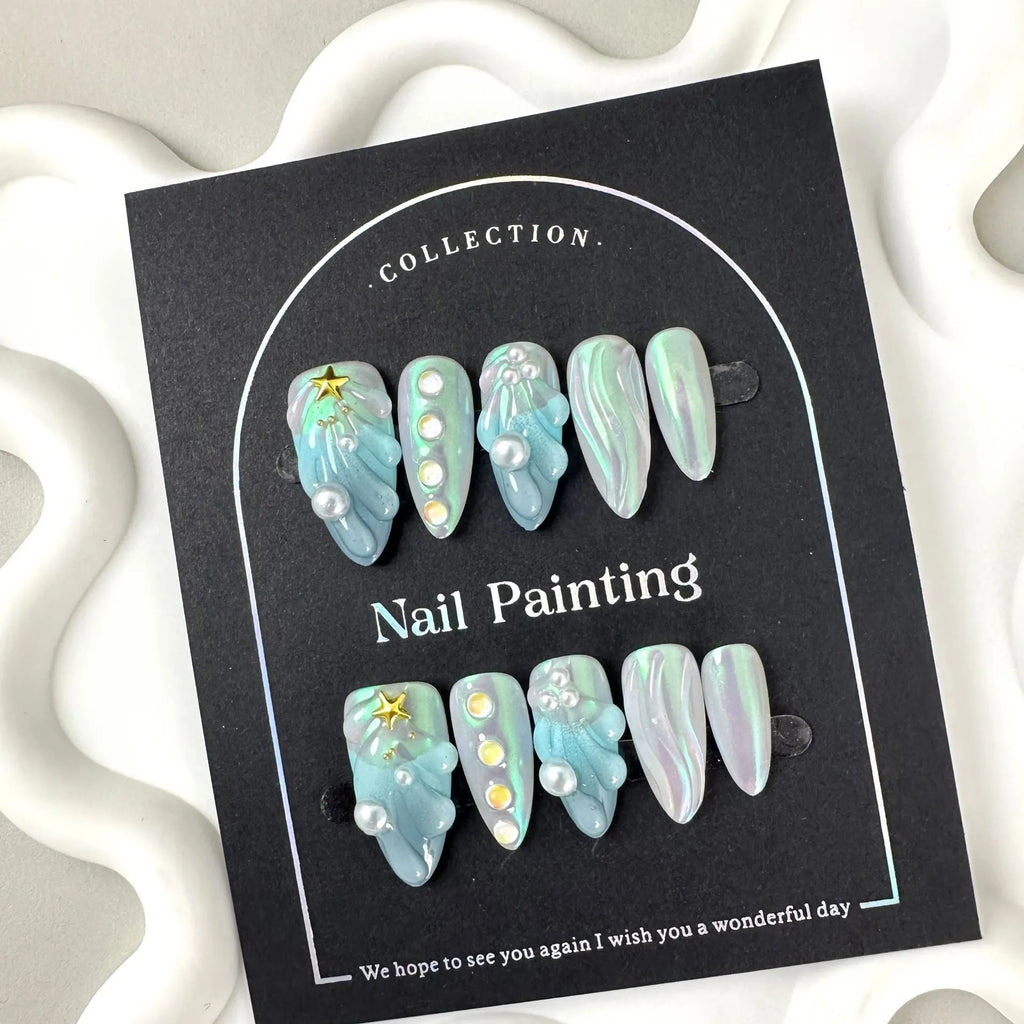 Blue summer design plastic false nail stickers in XS, S, M, L sizes.