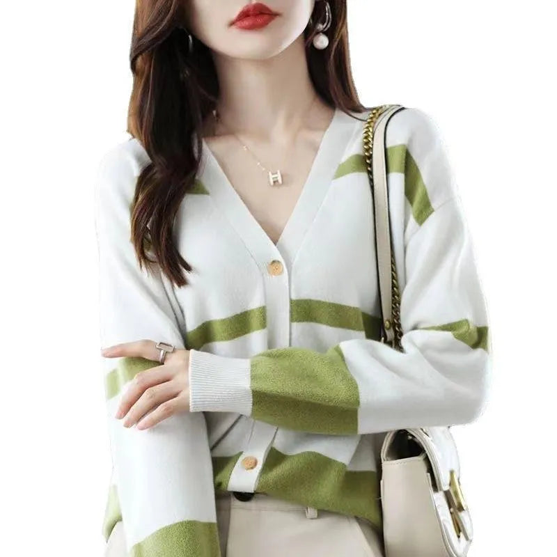 Women's striped V-neck knit cardigan buttoned up, shown in a slim fit.