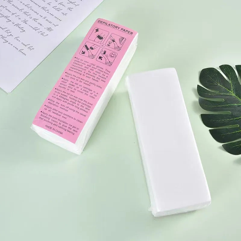 A pack of white non-woven fabric hair removal wax strips for body waxing.