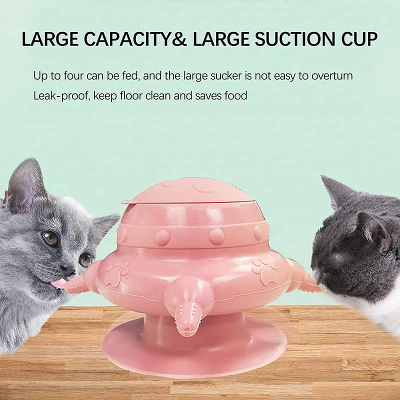 Pink silicone pet milk feeder with four nursing nipples for puppies and kittens on a flat base.