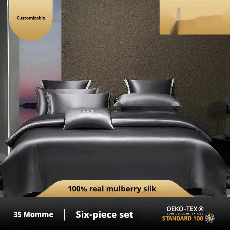 Solid colour silk four-piece quilt cover set shown in Champagne Gold on a bed