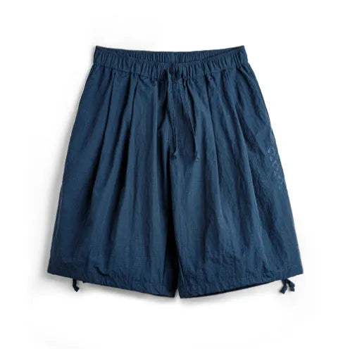 Men's loose-fit Prussian Blue nylon beach shorts with embroidered design on thigh