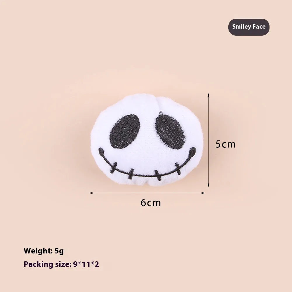 Small plush cat teaser toy with colourful candy or skull design on string