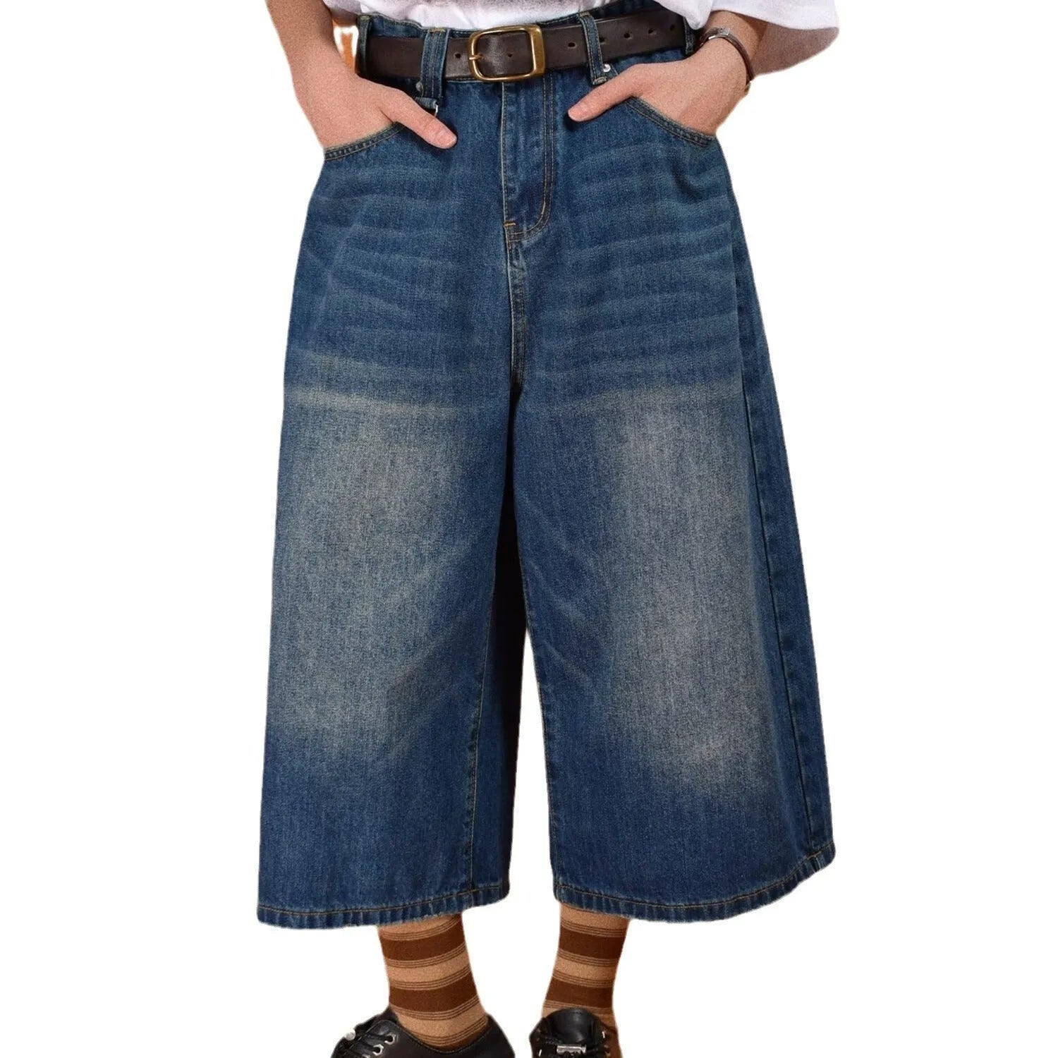 Men's loose straight fit denim shorts in blue, shown on a model for summer.