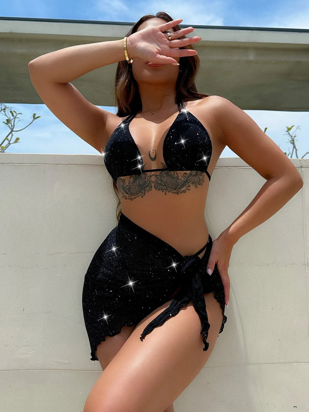 Black three-piece polyester bikini set with top and shorts on a size chart showing S, M, L.