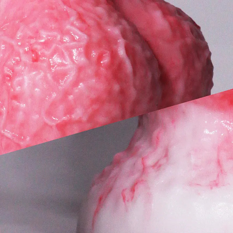 Pink platinum silicone shaped penis masturbation device for adults on a neutral background.