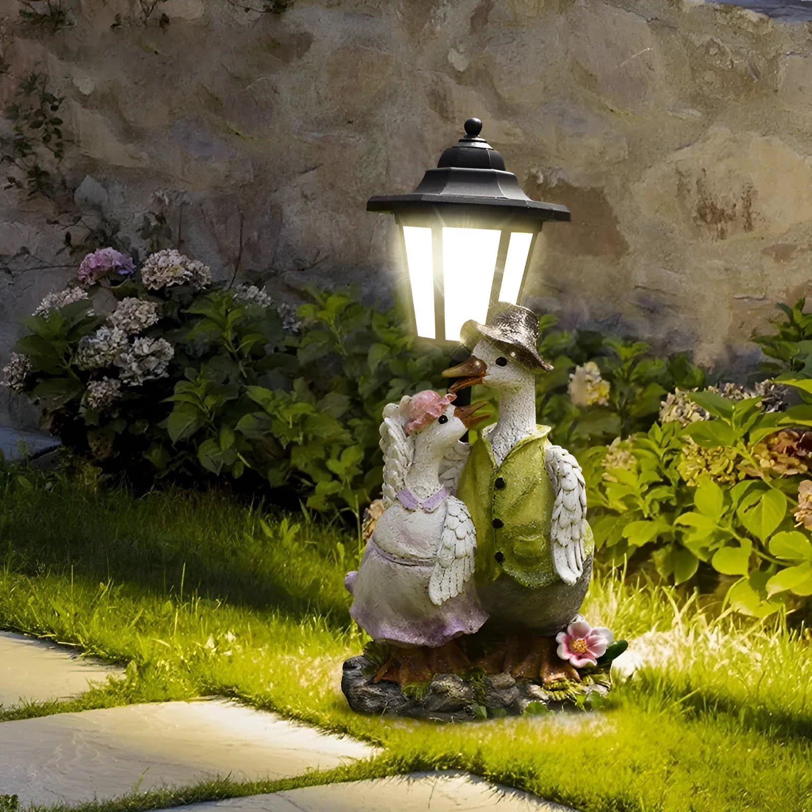 Hexagonal solar garden lamp with decorative resin animal design in outdoor setting