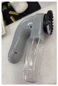 Grey handheld pet hair vacuum cleaner with soft rubber grooming head for dogs and cats