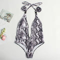 Women's backless one-piece swimsuit with adjustable buckle bandage in leopard print.