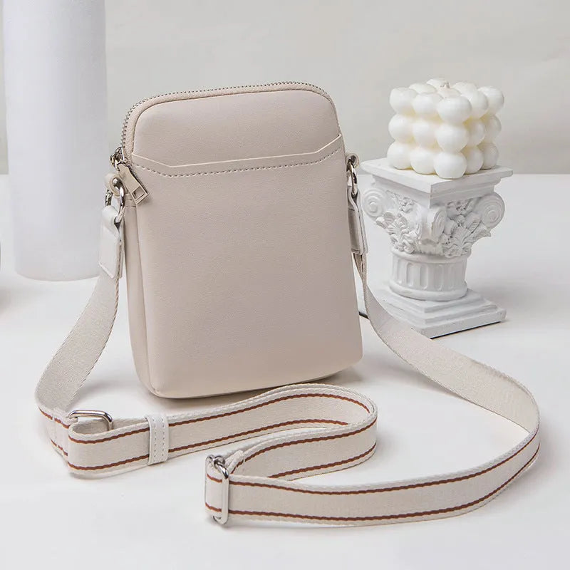 Solid colour PU crossbody shoulder bag for women in beige, showing compact size.