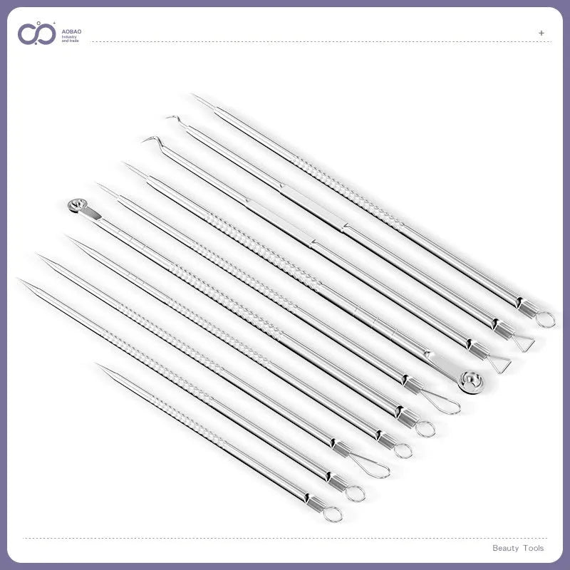 Four ultra fine metal acne needles and a metal acne clip laid out on a surface.