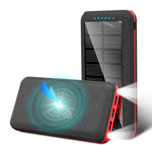 Black portable power bank with wireless charging surface and three USB ports for multiple device charging