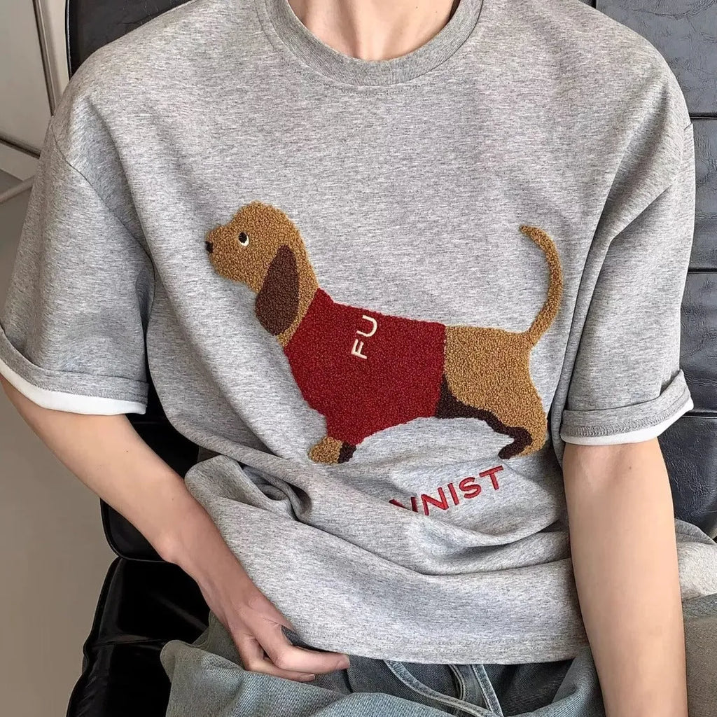 Men's grey cotton T-shirt with embroidered sausage dog holding towel design on front