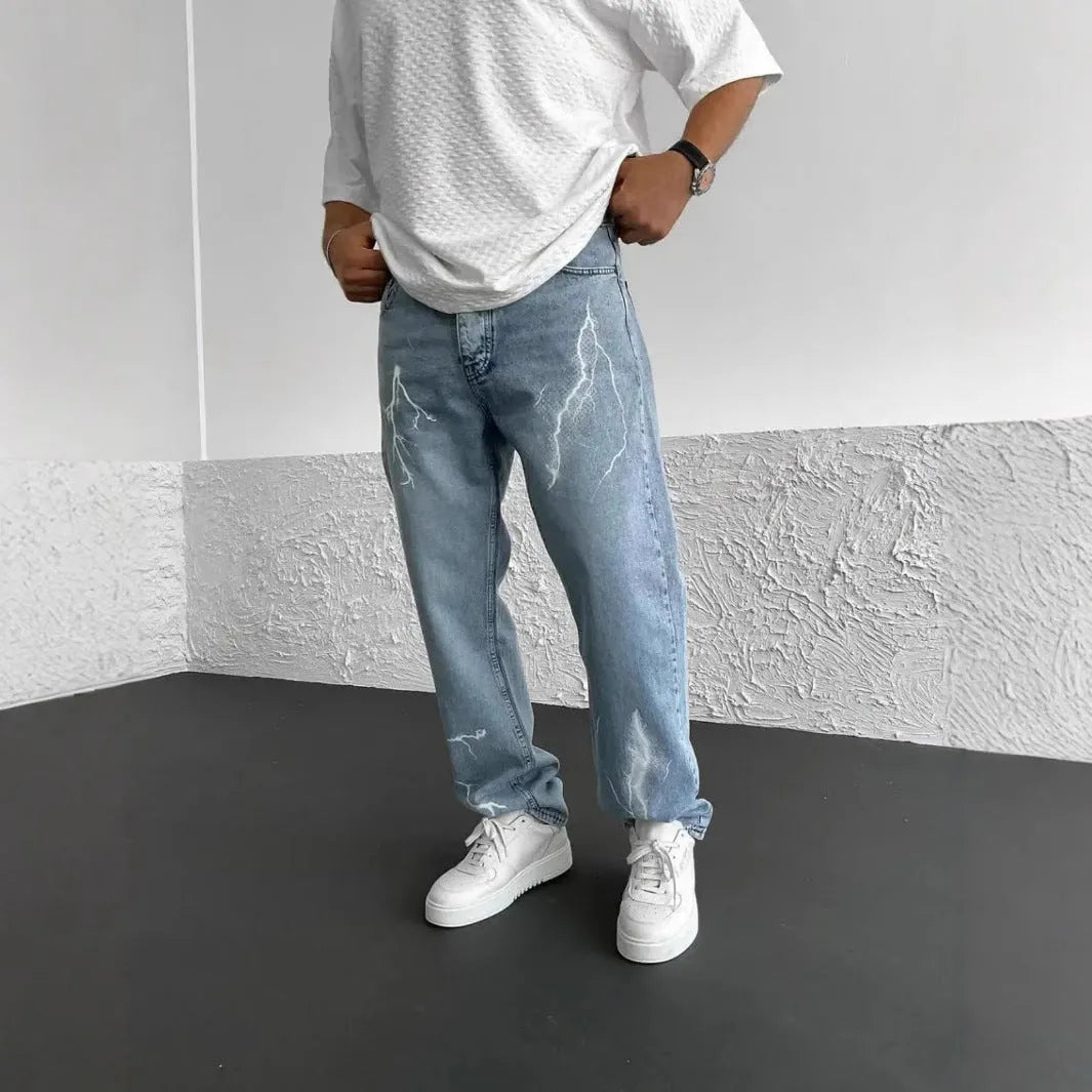 Men's blue straight-leg denim jeans with wide-leg silhouette and mid-waist design