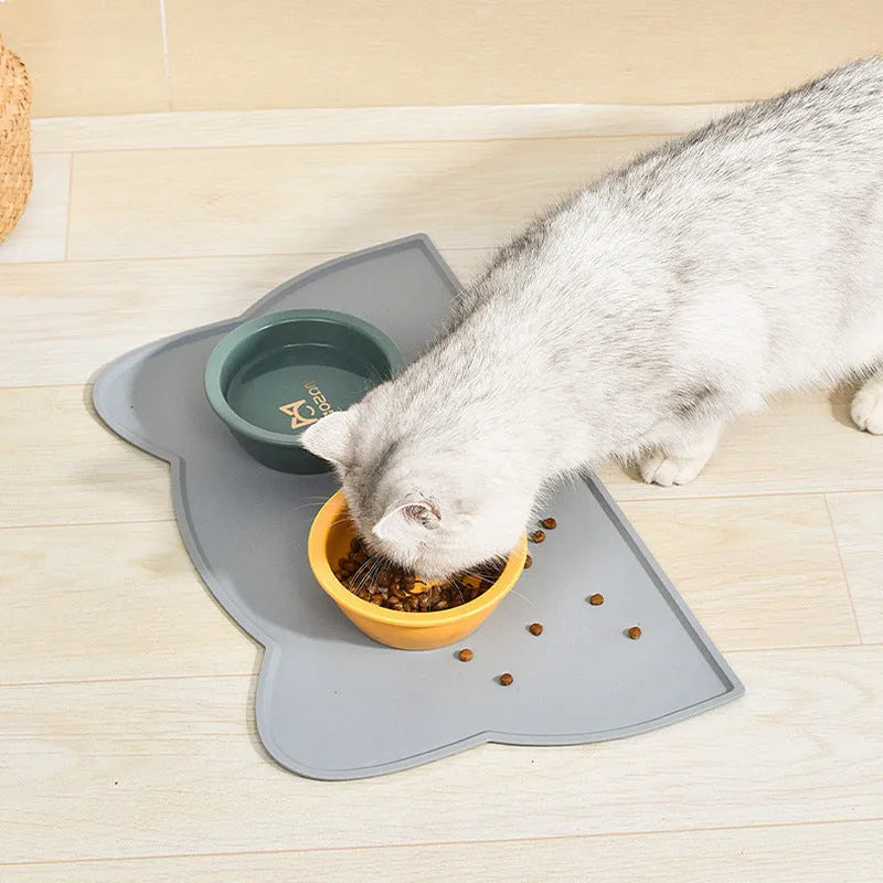 Blue silicone pet feeding mat measuring 44cm by 24cm under a dog bowl