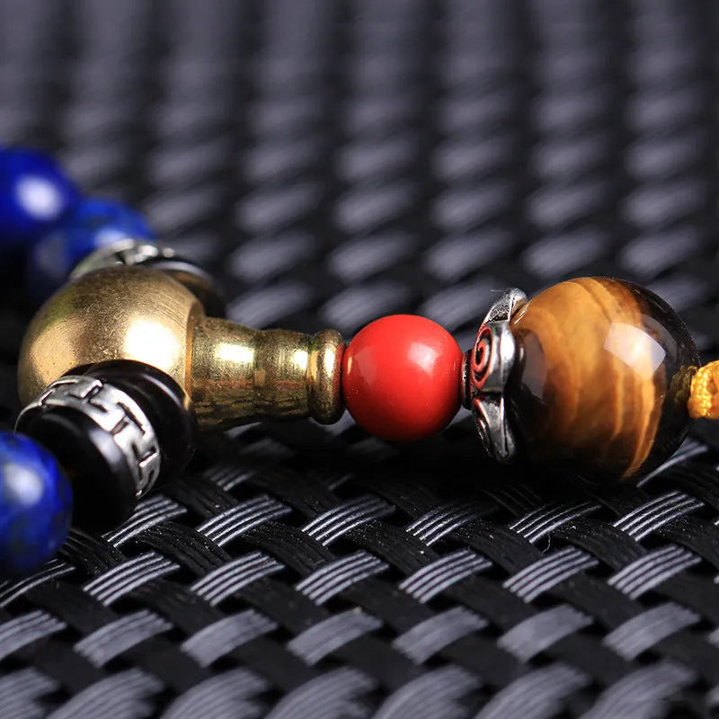 Natural Lapis Lazuli 108 bead bracelet in 8mm size on unisex wrist showing deep blue stone beads