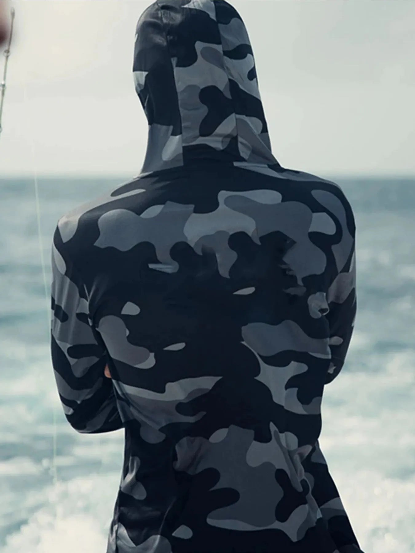 Men's grey long sleeve fishing hoodie shirt with integrated face mask and mesh side panels.