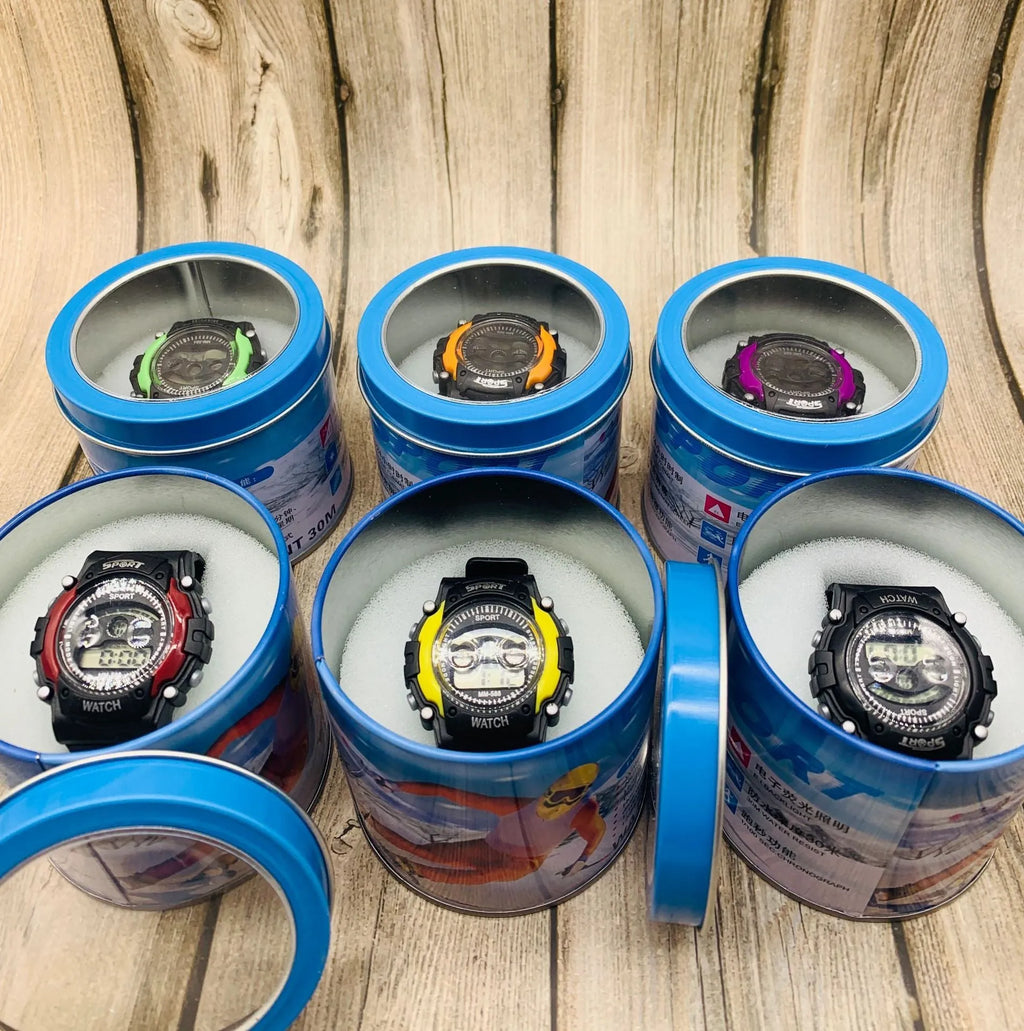 Children's digital sports watch with coloured silicone strap and plastic case on wrist