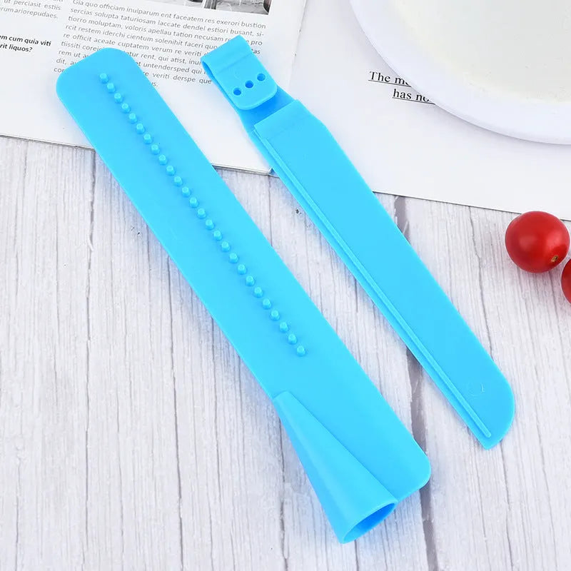 Blue ABS plastic cake smoother for cream scraping and smearing on a plain background