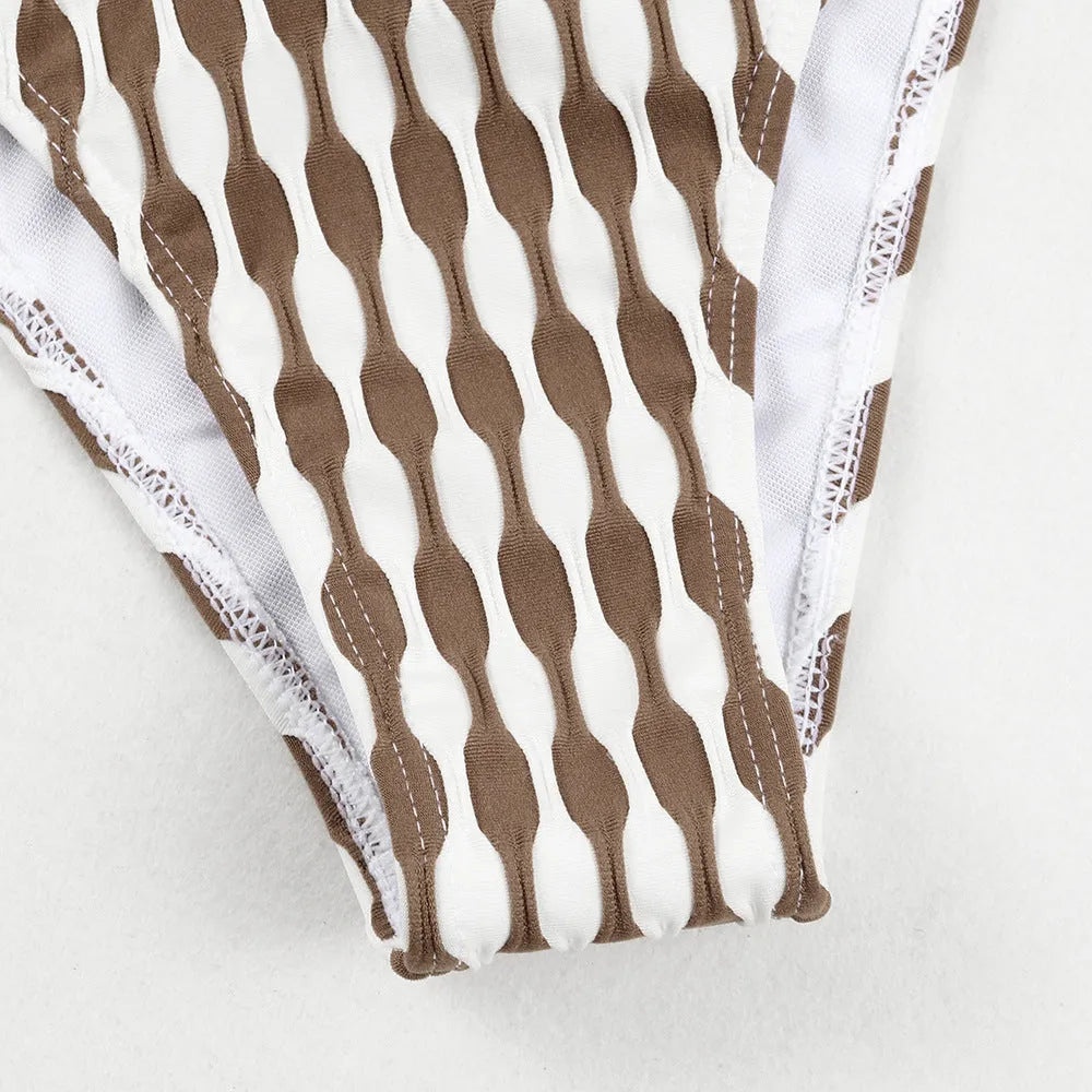 Women's striped three-piece swimsuit set with tube top, shorts, and waist skirt hem in colour option as pictured.