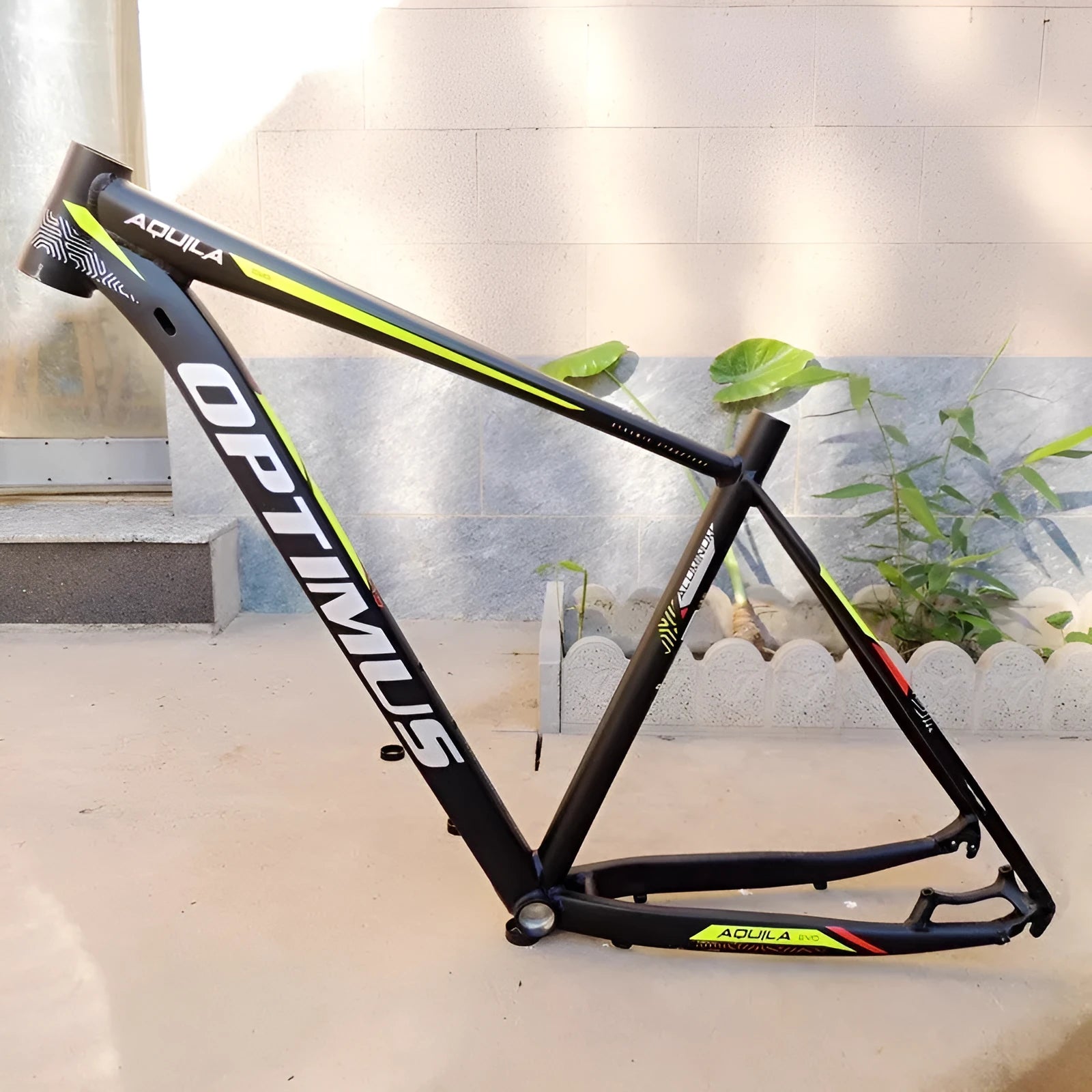 Black green aluminium 29-inch mountain bike frame showing disc brake mount and inner cable ports.