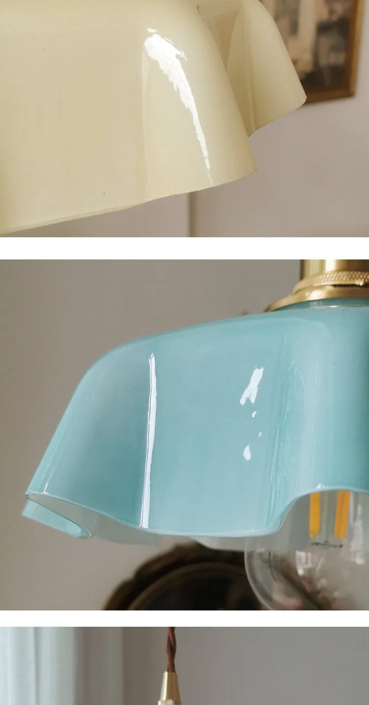 Medieval-style brass and cream glass chandelier light fitting with adjustable cord.