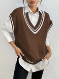 Women's loose fit pullover vest sweater in a college style, shown in blue.