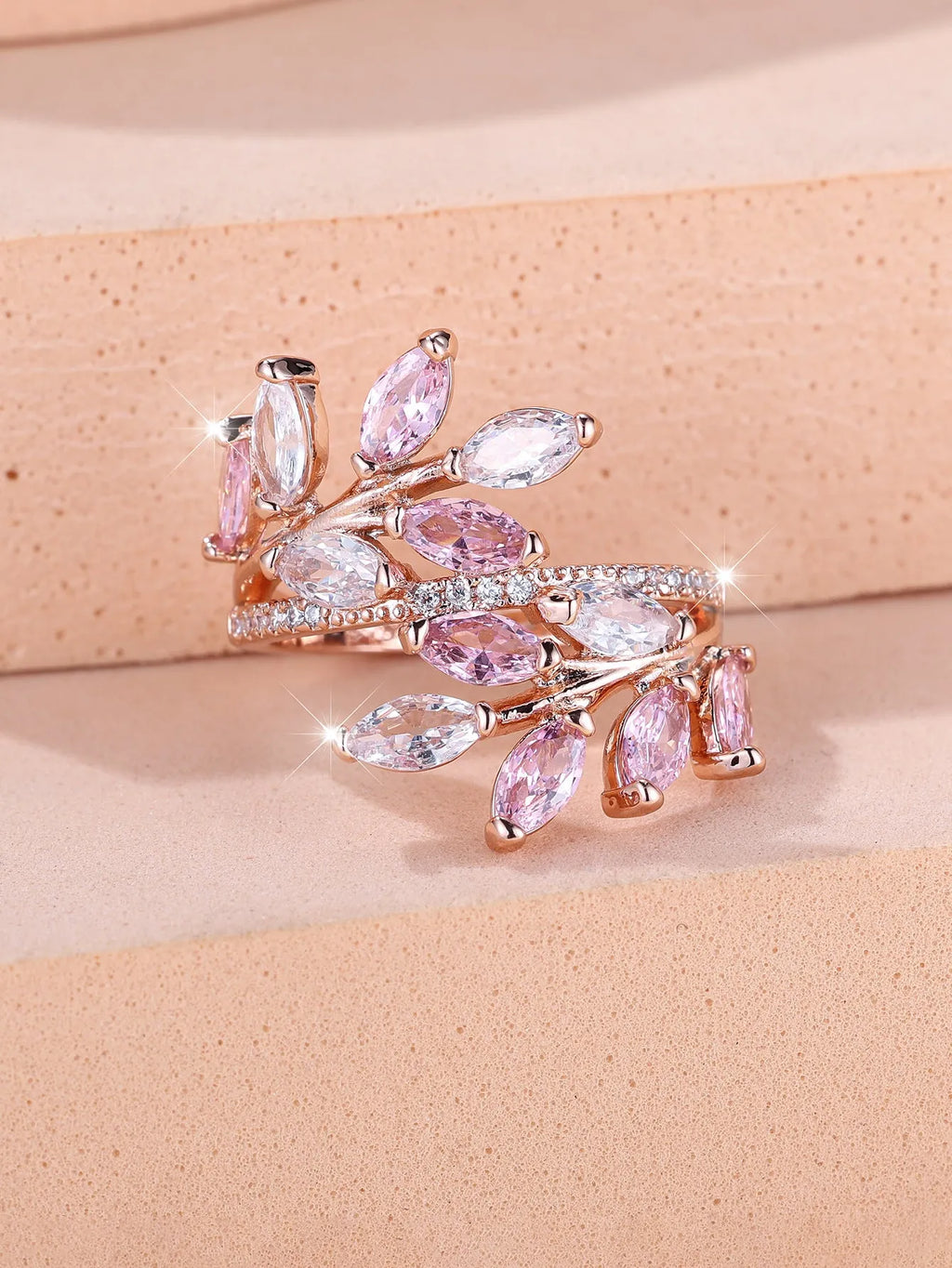 Copper leaf-shaped ring with adjustable band and central horse eye zircon stone in a choice of colours.