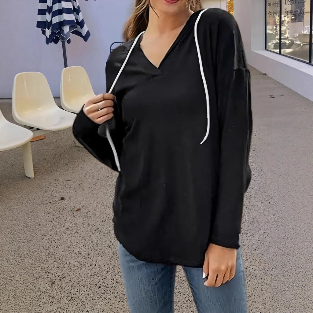 Red women's hooded V-neck sweatshirt with long sleeves on a hanger