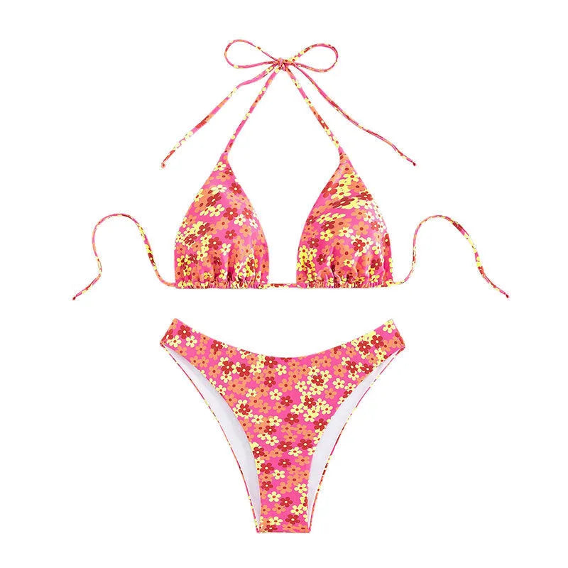 Blue printed women's bikini set with lace-up split top and matching shorts on a neutral background.