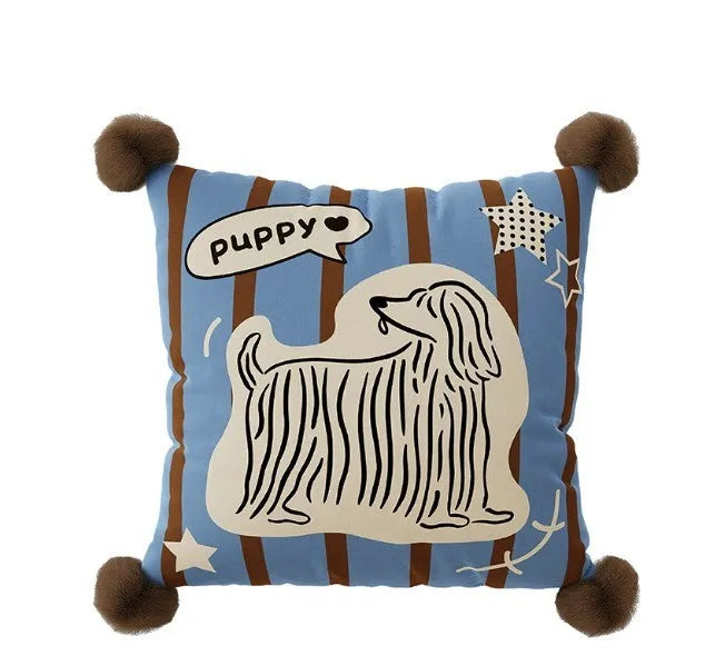 Blue cartoon animal print sofa cushion pillow on a sofa next to a brown one.