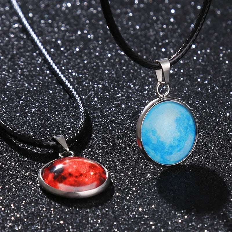 Luminous Christmas moon and night sky pendant necklace with adjustable chain on display