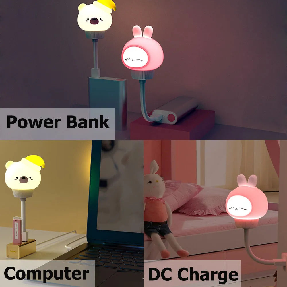 USB portable LED night light in cartoon bear shape with remote control on wooden table.