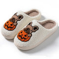 Black and white Halloween pumpkin slippers with plush upper and non-slip TPR soles