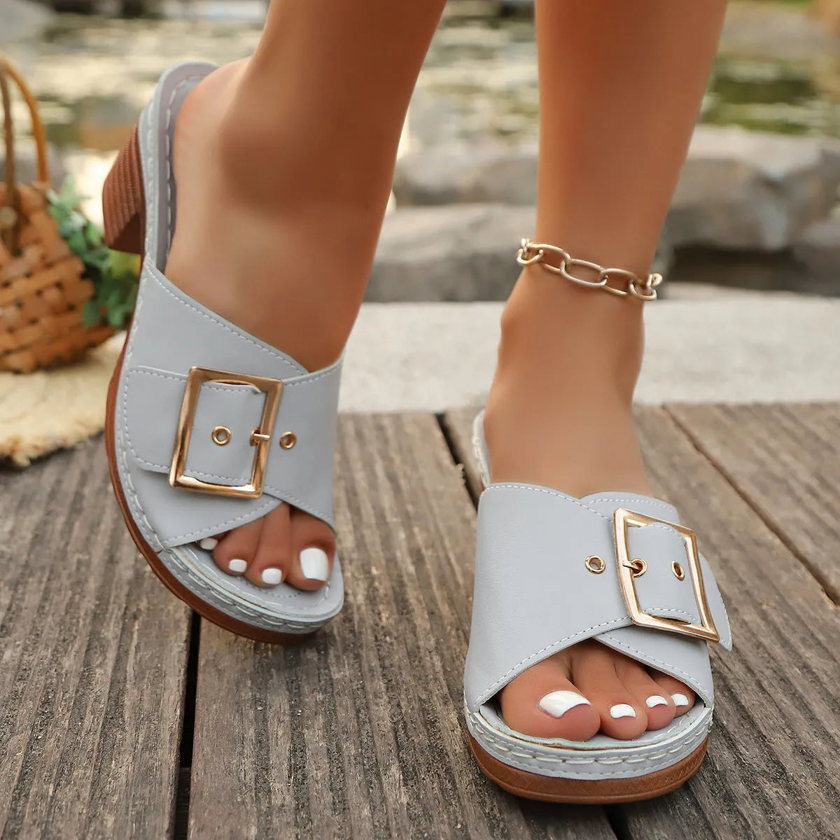 Women's black and light blue chunky heel slippers with metal buckle detail in retro style