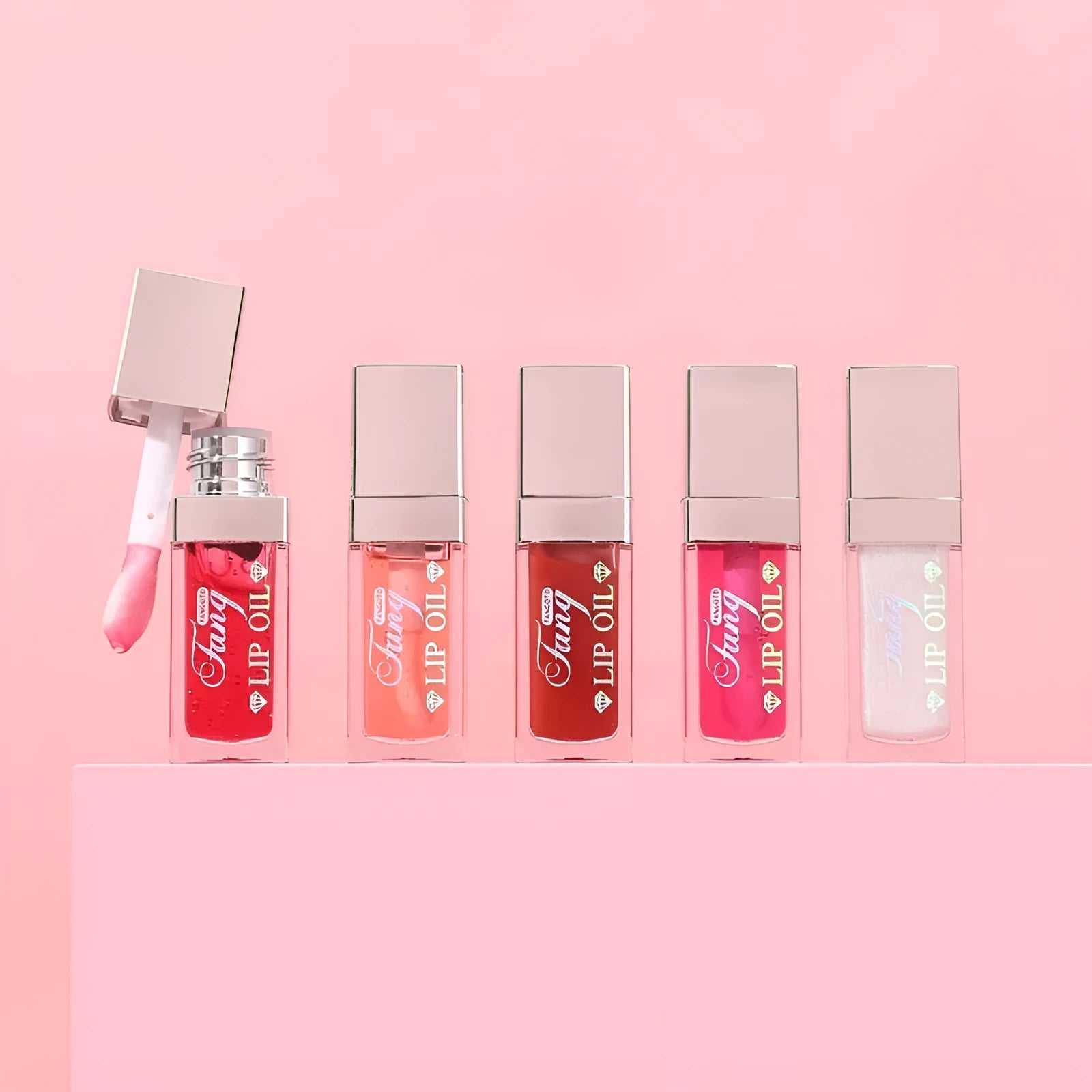 Five colour options of a bright mint lip gloss lipstick with moisturising lip essence oil.