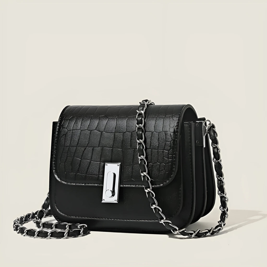 Women's black PU leather crossbody shoulder bag showing horizontal square shape and outer sandwich pocket